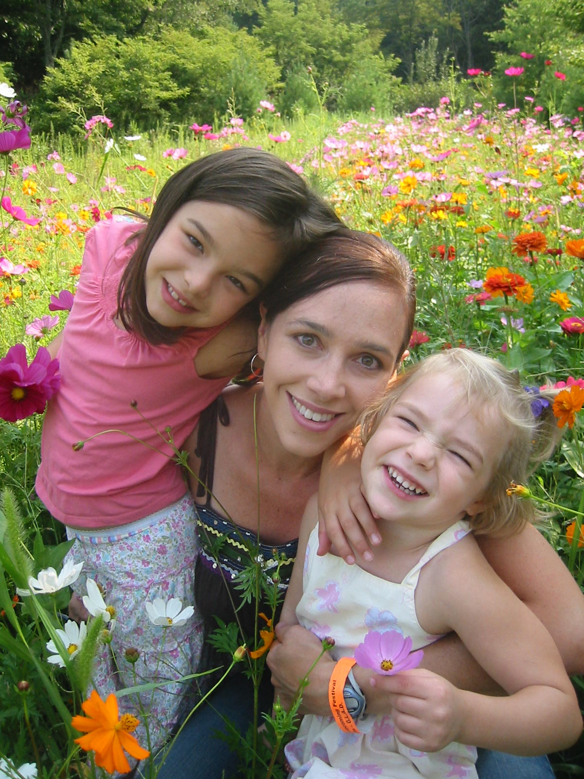Anna, Erin, Malia in a field of wildflowers